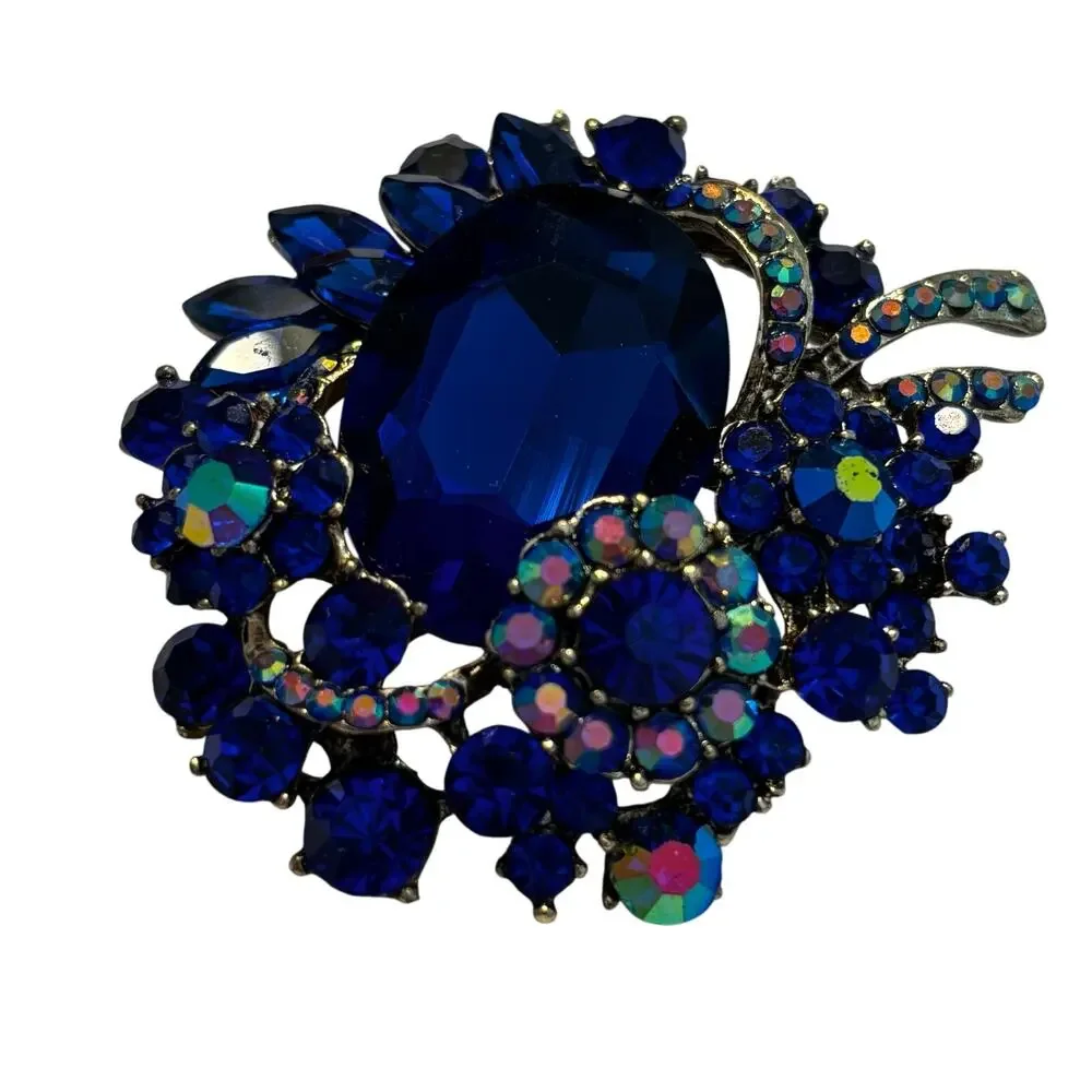 Vintage inspired chunky blue rhinestones brooch ornate silvertone AB finish